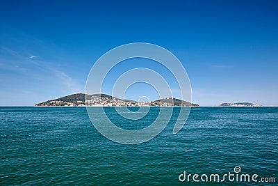 Island with houses in the sea, Blue sea and blue sky. The Sea of Marmara, Heybeliada and Burgazada, Adalar, Stock Photo